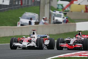 Jarno Trulli (Toyota), Heikki Kovalainen (McLaren-Mercedes)