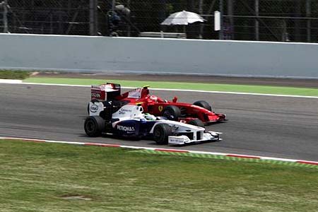 Nick Heidfeld (BMW Sauber), Kimi Raikkonen (Ferrari)