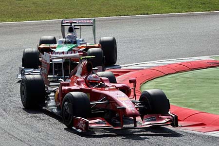 Kimi Raikkonen (Ferrari), Adrian Sutil (Force India-Mercedes)